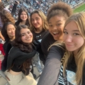Group Of Girls In The Stands At A Soccer Stadium