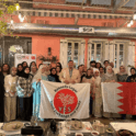 Group Of People Holding The Kl Yes Logo Flag And The Bahrain Flag