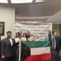 Group of people in business clothes holding the Kuwaiti flag