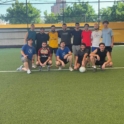 Group photo of alumni on the football field