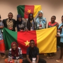 YES student, Sakina, with a group of exchange students holding the Cameroonian flag