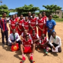 A group of male soccer players in uniforms