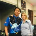 Yudha smiling with his arms around his teacher, Mrs. Lanning