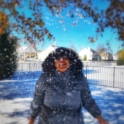 Imen throws snow into the air as she celebrates her first snow