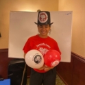 Isra in a YES shirt holding balloons
