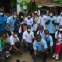 Group of alumni in Kenya wearing YES shirts and wearing masks.