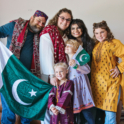 Kehkashan wither her host family holding Pakistani flags