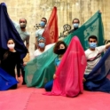 YES alumni in Lebanon holding up colorful scarfs and wearing masks. 