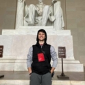 Maksim Stands In Front Of Lincoln Memorial
