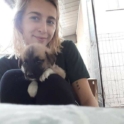 Marija Miteva At The Shalter Taking Care Of A Puppy