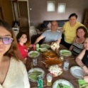 Marija and her families eat a meal