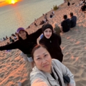 Nagham and host family on the beach at sunset