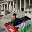 Omar holding the Jordanian flag at the US Capitol