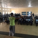 Student giving a presentation to a group of students in a classroom