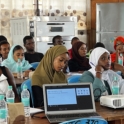 Participants seated and following a session attentively
