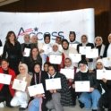 A large group of young women holding certificates