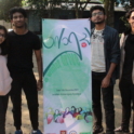Four Bangladeshi YES alumni with Project Asroy banner