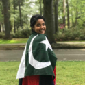 YES student Rijja with a Pakistani flag wrapped around her