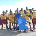 Group of young boys in soccer jerseys.