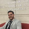 Nassim sitting in the U.S. Embassy.