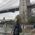 YES student, Hina standing in front of the Brooklyn Bridge.