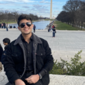 Nasir posing with Washington monument.