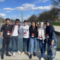 Muskan standing with group in front of Washington Monument