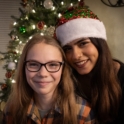 The student poses with her host sister in front of a Christmas tree jpeg