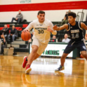 Two boys playing basketball