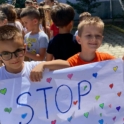 Two Children In Albania Hold A Sign Encouraging The Public To Stop Single Use Plastic Use
