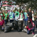YES alumni holding up letters that read "GYSD 17" and standing next to full trash bags