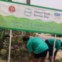 Yes Alumni Cleaning Up A Street.  A Sign Above Them Says "GYSD 2015"