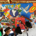 Yes Alumni Painting A Colorful Mural At A Local Orphanage