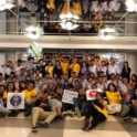 Large group photo of dozens of people smiling