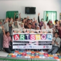 YES alumni hold a banner that says, "ArtShop"