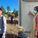 Two photos, YES student volunteering, YES student writing on board