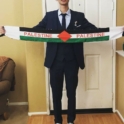 Hassan holding a sign that says Palestine