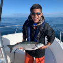 Hammad Posing With Fish He Caught.