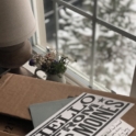A post card reading "Hello from Des Moines"