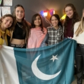 Preet from Pakistan holds Pakistani flag with other exchange students