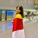 Mathilda holding the Indonesian flag