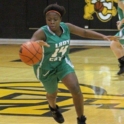 Joyce dribbling a basketball during a game